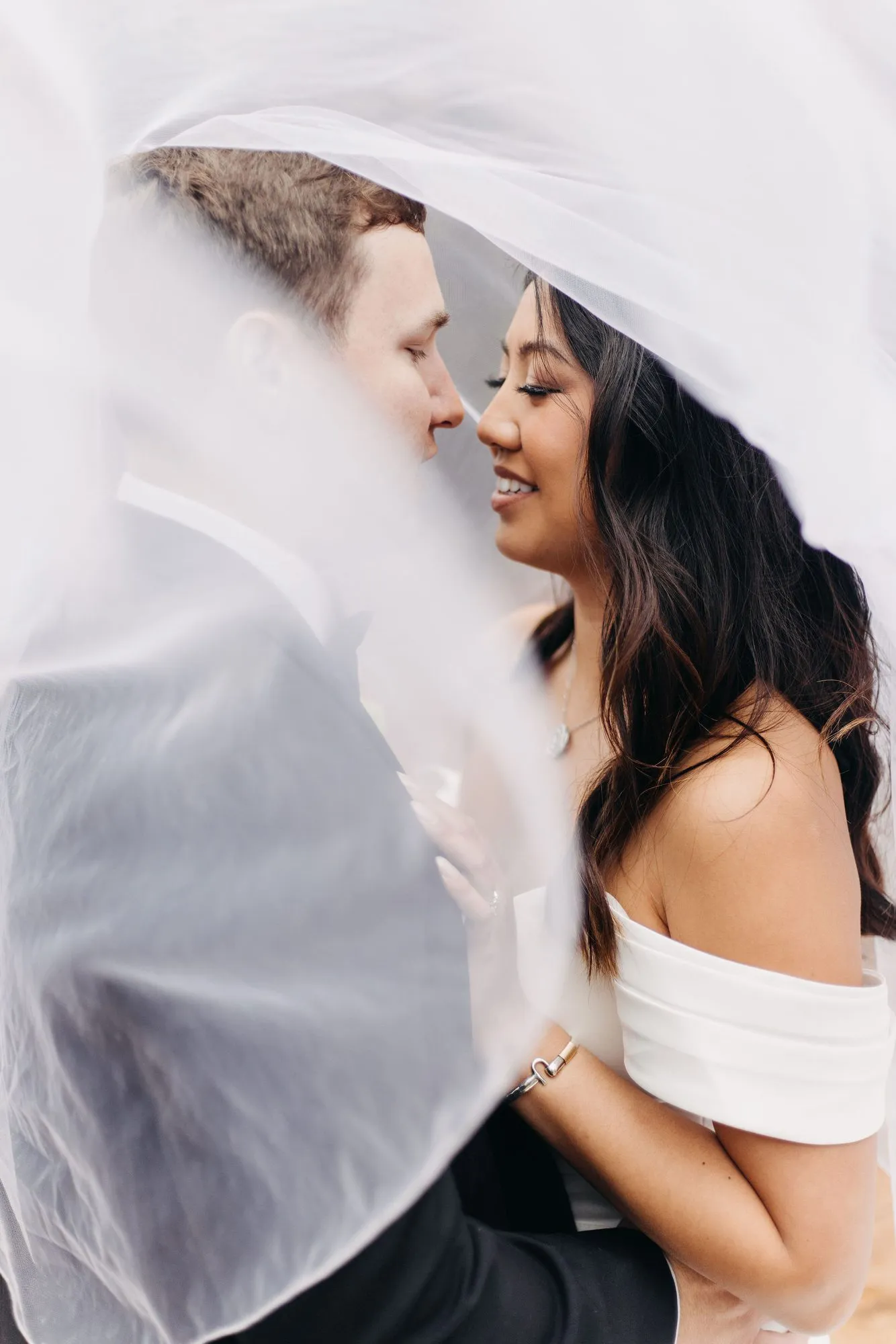 Cindy and Nick beneath the veil