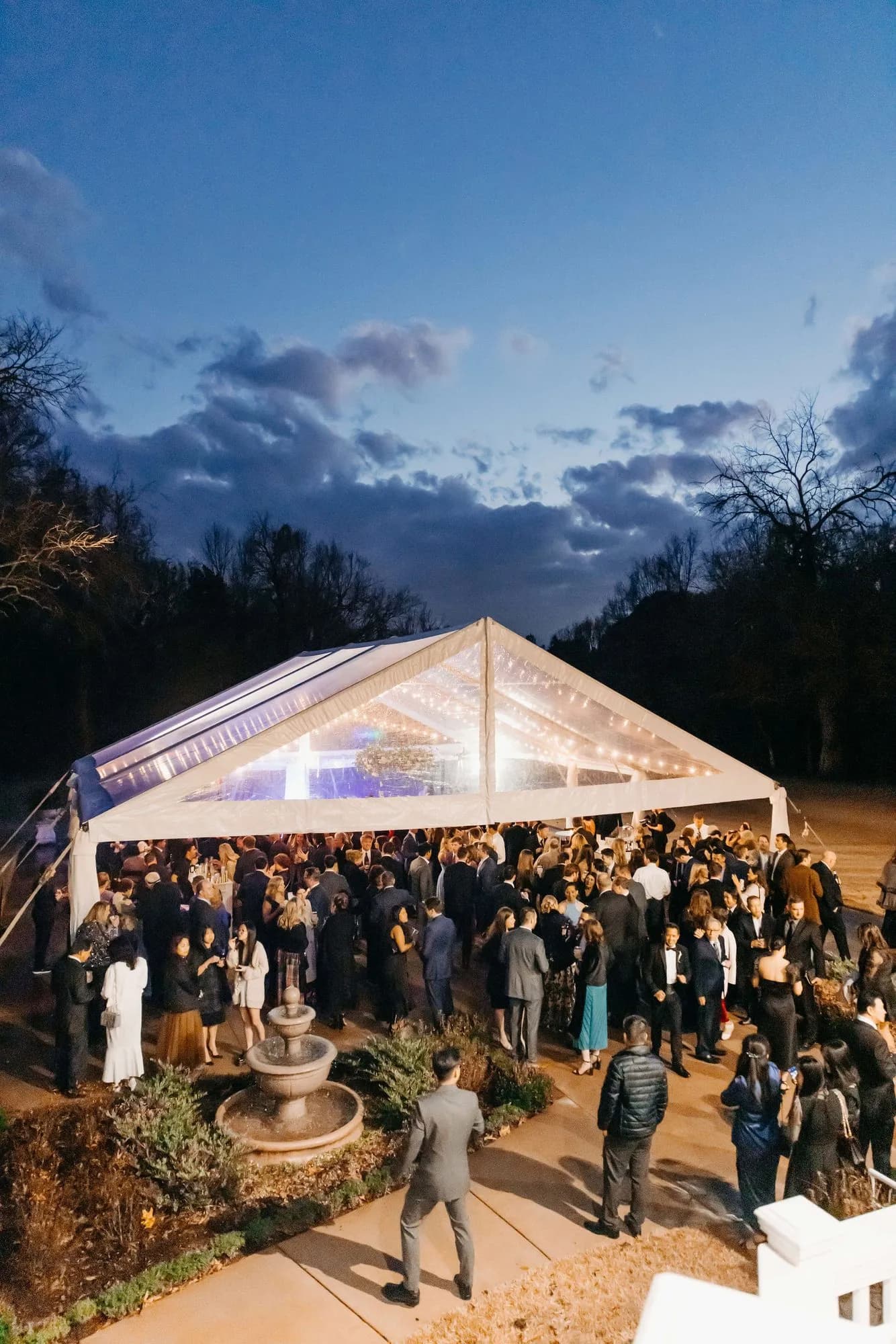 The reception tent glowing at blue hour