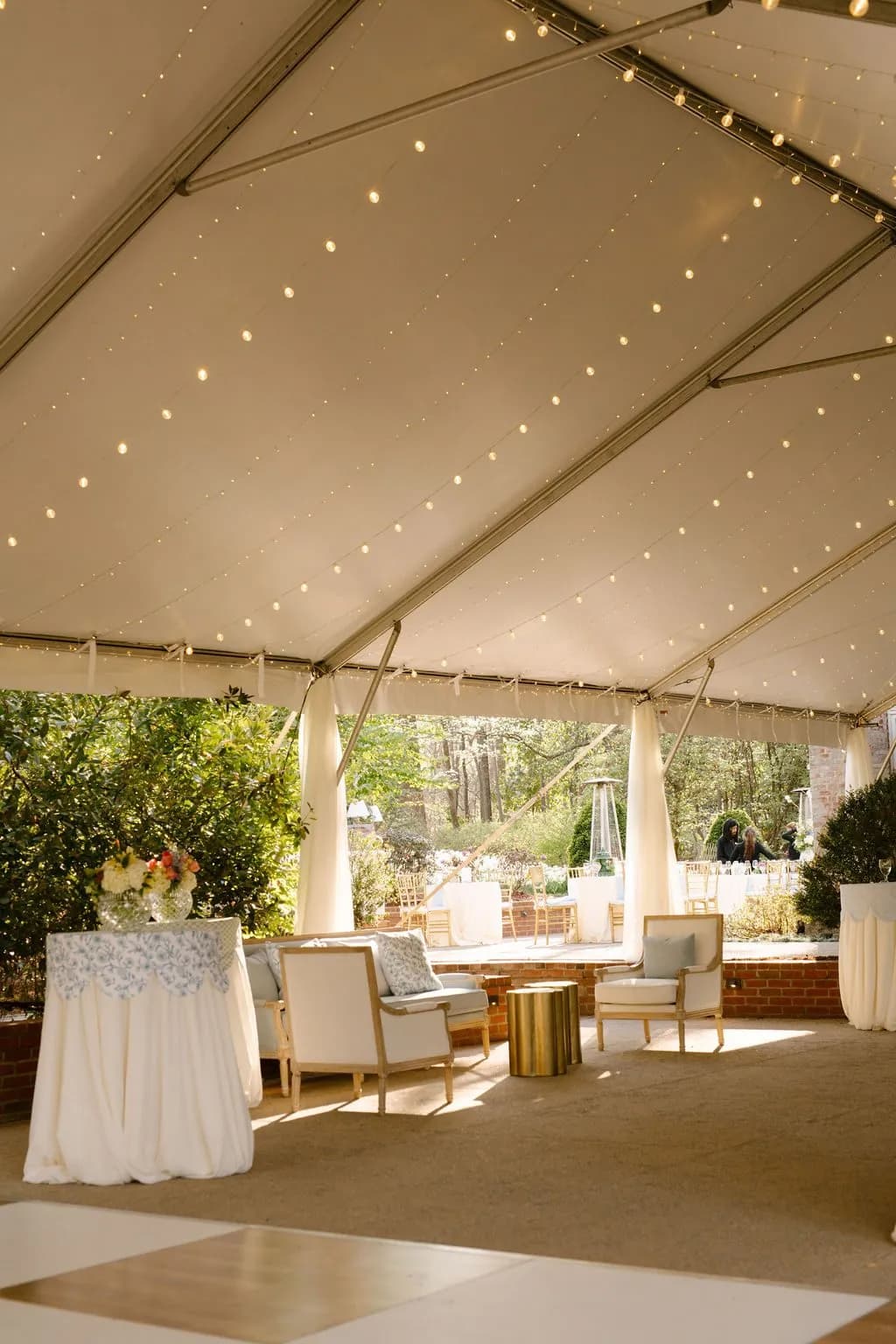 The reception tent strung with lights